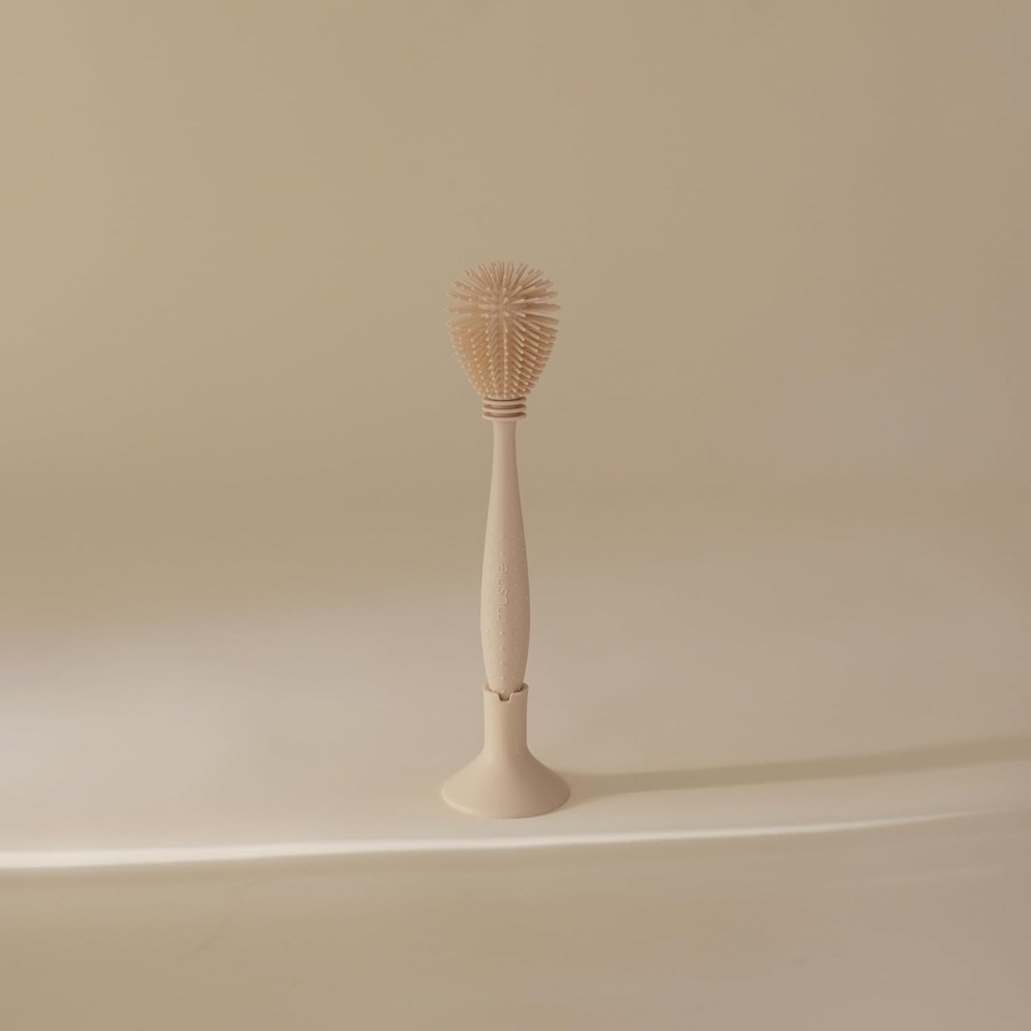mushie Baby Bottle Brush | Soft Silicone with Suction Base (Shifting Sand)